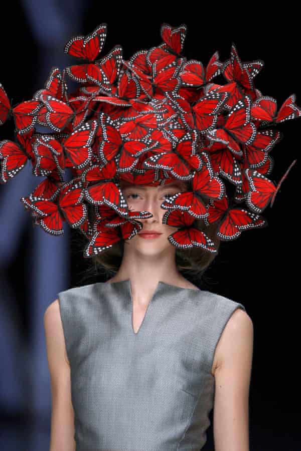 A model wears a butterfly headpiece in the designer&squot;s Spring/Summer 2008 show, "La Dame Bleue."