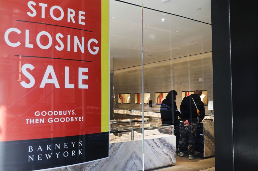 A couple shops Barneys New York's going-out-of-business sale in 2019.