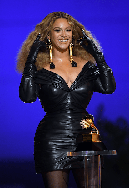 Beyoncé accepts one of her many Grammys in Schiaparelli Haute Couture.